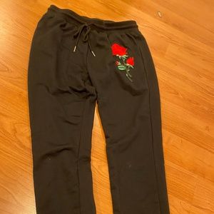 Black sweatpants with Rose patch